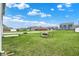 A large backyard, showcasing a well-maintained lawn and neighborhood views in a suburban setting at 8961 Fitzgerald Dr, Indianapolis, IN 46239