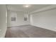 Spacious bedroom with neutral walls and carpet, featuring two windows with blinds at 8961 Fitzgerald Dr, Indianapolis, IN 46239