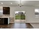 The dining area has wood floors and sliding glass doors out to the backyard for relaxing or entertaining at 8961 Fitzgerald Dr, Indianapolis, IN 46239