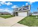 Beautiful home featuring a brick facade, a well-kept lawn and a two car driveway at 8961 Fitzgerald Dr, Indianapolis, IN 46239