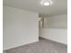Neutral-colored hallway with access to other rooms, carpeted floor, and a modern light fixture at 8961 Fitzgerald Dr, Indianapolis, IN 46239