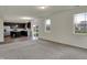 Inviting living room showcases an open layout, seamlessly flowing into a modern kitchen with ample natural light at 8961 Fitzgerald Dr, Indianapolis, IN 46239
