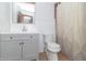 Bathroom with a light gray vanity, gold mirror, and gold shower curtain accents at 918 N 700 W, Greenfield, IN 46140