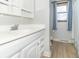 Bright bathroom featuring a modern vanity with chrome faucet and a window with natural light at 918 N 700 W, Greenfield, IN 46140