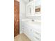 Bright bathroom featuring a modern vanity with chrome pulls, drawers, and cabinets for storage at 918 N 700 W, Greenfield, IN 46140