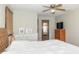 Bedroom featuring light walls, a ceiling fan, and two dressers with ample storage at 918 N 700 W, Greenfield, IN 46140