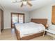 Bedroom featuring a woven-style headboard and sliding glass doors to the backyard at 918 N 700 W, Greenfield, IN 46140