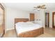 Bedroom with a woven-style headboard, ceiling fan, and natural light from a large window at 918 N 700 W, Greenfield, IN 46140
