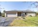 Charming home with stone facade, well-manicured lawn, and attached garage at 918 N 700 W, Greenfield, IN 46140