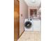 Bright laundry room features a washer and dryer with tile floors at 918 N 700 W, Greenfield, IN 46140