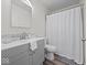 Bathroom with a shower/tub combo and a gray vanity at 936 Eagle Brook Cir, Shelbyville, IN 46176