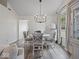 Bright dining room with a modern chandelier and ample natural light at 936 Eagle Brook Cir, Shelbyville, IN 46176