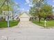 A well-manicured front lawn leads to this home with an attached two car garage at 936 Eagle Brook Cir, Shelbyville, IN 46176