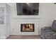 Close-up of a cozy fireplace with a white mantle, perfect for chilly evenings at 936 Eagle Brook Cir, Shelbyville, IN 46176