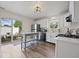 Modern kitchen with white cabinets, stainless steel appliances, and a sliding glass door to the patio at 936 Eagle Brook Cir, Shelbyville, IN 46176