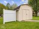 Backyard features a clean shed with neutral paint, perfect for storage or hobbies at 936 Eagle Brook Cir, Shelbyville, IN 46176