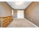 Bedroom showcasing neutral carpet, a dresser, and a closet with double white doors at 9609 Highgate N Cir, Indianapolis, IN 46250