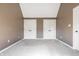 Spacious bedroom featuring neutral carpeting and double closets for ample storage at 9609 Highgate N Cir, Indianapolis, IN 46250