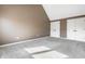 Bedroom featuring plush carpeting, neutral walls, and ample closet space for storage at 9609 Highgate N Cir, Indianapolis, IN 46250