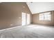 Bedroom boasts neutral carpeting, a vaulted ceiling, and ample closet space at 9609 Highgate N Cir, Indianapolis, IN 46250
