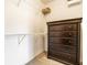Closet showing white wire shelving, a dark wood dresser and neutral carpet at 9609 Highgate N Cir, Indianapolis, IN 46250