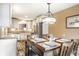 Eat-in kitchen dining area features light fixture and space for four at 9609 Highgate N Cir, Indianapolis, IN 46250