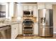 Open-concept kitchen features stainless steel appliances and ample lighting at 9609 Highgate N Cir, Indianapolis, IN 46250