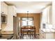 Bright kitchen features stainless steel appliances and a cozy dining area with natural light at 9609 Highgate N Cir, Indianapolis, IN 46250