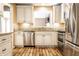 Modern kitchen featuring stainless steel appliances, granite counters, and wood floors at 9609 Highgate N Cir, Indianapolis, IN 46250
