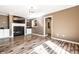 Spacious living room boasts wood floors, a fireplace, and a pass-through to the kitchen at 9609 Highgate N Cir, Indianapolis, IN 46250
