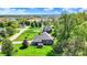 Overhead view of a home with a well-maintained lawn, mature trees, and an inviting landscape at 9879 Ruby Ct, Mooresville, IN 46158