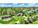 Stunning aerial view of homes surrounded by lush greenery and blue skies in a peaceful neighborhood setting at 9879 Ruby Ct, Mooresville, IN 46158