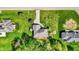A bird's-eye view of a home with well-kept lawn, landscaping, and a patio, offering a private outdoor space at 9879 Ruby Ct, Mooresville, IN 46158