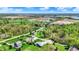 Beautiful aerial view of a neighborhood featuring homes with green lawns and picturesque ponds and trees in the background at 9879 Ruby Ct, Mooresville, IN 46158