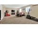 Finished basement area with a tv, furnishings, exercise equipment, and neutral carpet at 9879 Ruby Ct, Mooresville, IN 46158