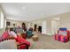 Spacious finished basement featuring neutral carpet, a variety of seating and access to other areas at 9879 Ruby Ct, Mooresville, IN 46158