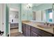 Bathroom featuring a double vanity with wood cabinets, and an open doorway to the bedroom at 9879 Ruby Ct, Mooresville, IN 46158