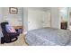 Bedroom with a comfortable chair, desk, and closets at 9879 Ruby Ct, Mooresville, IN 46158