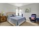 Bright bedroom with a comfortable bed, cozy chair, and calming decor at 9879 Ruby Ct, Mooresville, IN 46158