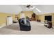 Bonus room with fan, skylights, neutral carpet, and a tv, furniture and decor at 9879 Ruby Ct, Mooresville, IN 46158