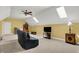 Bonus room with fan, skylights, neutral carpet, and a tv, furniture and decor at 9879 Ruby Ct, Mooresville, IN 46158