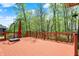 Spacious wooden deck overlooking a scenic wooded lot, perfect for outdoor entertaining at 9879 Ruby Ct, Mooresville, IN 46158
