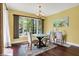 Bright dining room with large windows offering views of backyard at 9879 Ruby Ct, Mooresville, IN 46158