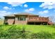 Lovely home exterior with a wooden deck and well-manicured lawn; perfect for relaxing in nature at 9879 Ruby Ct, Mooresville, IN 46158