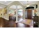 Inviting foyer showcasing hardwood floors, an arched entryway, and natural light at 9879 Ruby Ct, Mooresville, IN 46158