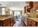 Elegant kitchen with granite countertops, custom cabinets, and stainless steel appliances at 9879 Ruby Ct, Mooresville, IN 46158