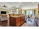 Open kitchen with granite countertops and stainless steel appliances flowing into the dining and living rooms at 9879 Ruby Ct, Mooresville, IN 46158