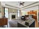 Cozy living room with a fireplace, hardwood floors, and an open layout to the kitchen at 9879 Ruby Ct, Mooresville, IN 46158