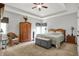 Spacious main bedroom featuring a tray ceiling, carpet floors, and comfortable furniture at 9879 Ruby Ct, Mooresville, IN 46158
