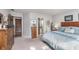 Relaxing bedroom featuring a plush bed, soft lighting, and access to closet and bathroom at 10518 Greenway Dr, Fishers, IN 46037